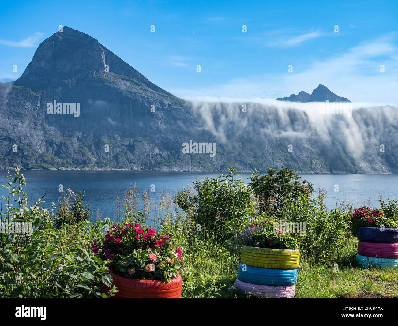 View from rest area over fjord Mefjord on Senja island, in the background the peaks of famous Segla mountain and mt. Grytetippen,  Norway Stock Photo
