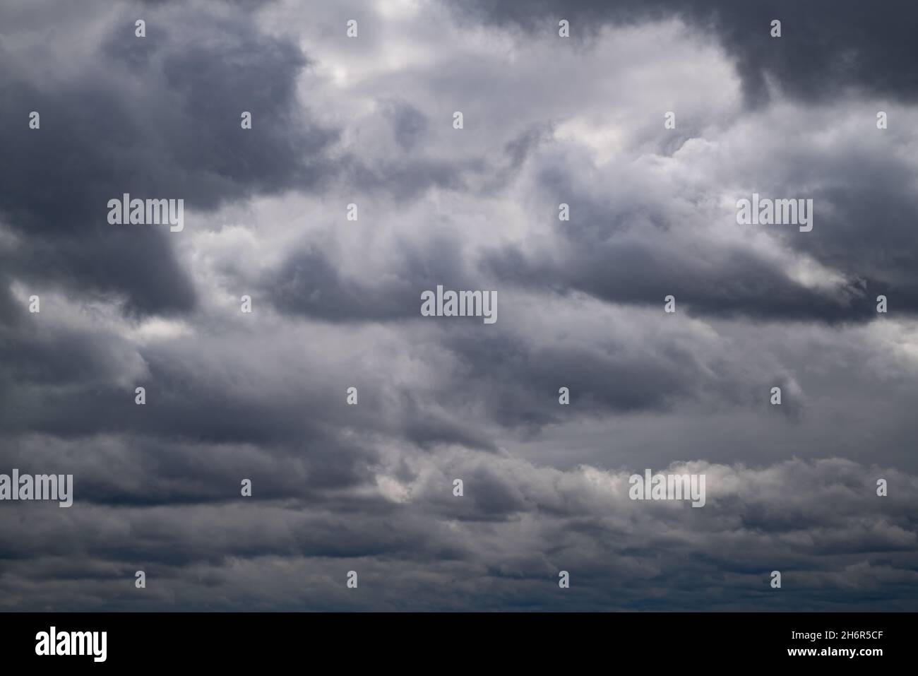 dark storm clouds in the evening spring sky Stock Photo