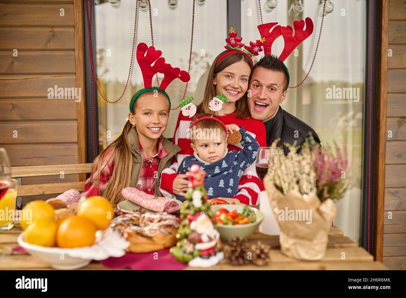 A cute family celebrating new year together Stock Photo