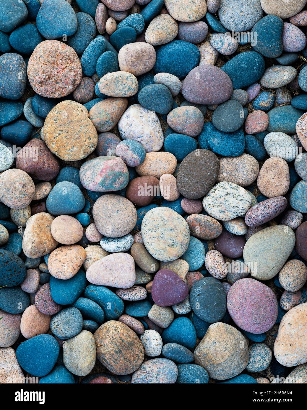 Smooth colorful stones along the shore of Lake Superior in the Upper Peninsula of Michigan Stock Photo