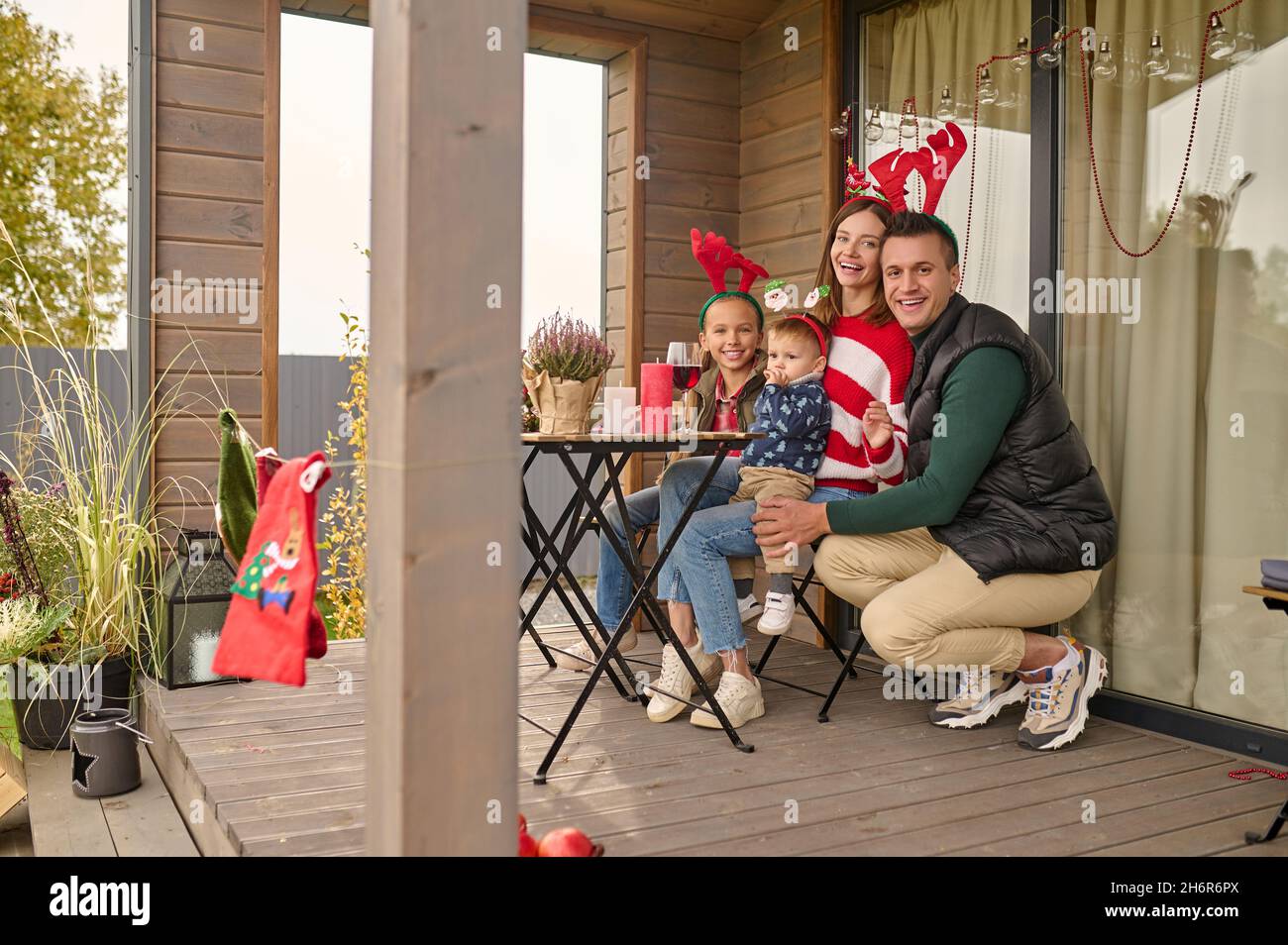 A young family celebrating christmas in the country house Stock Photo