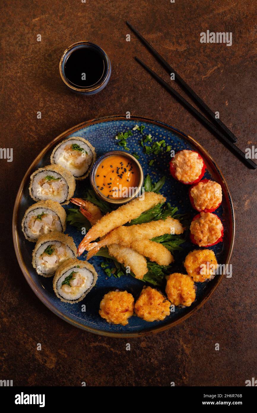 Sushi Set, Sashimi, Rolls Set on Table. Asian Cuisine. Healthy Food. Wakame Salat and Sushi Sticks Stock Photo