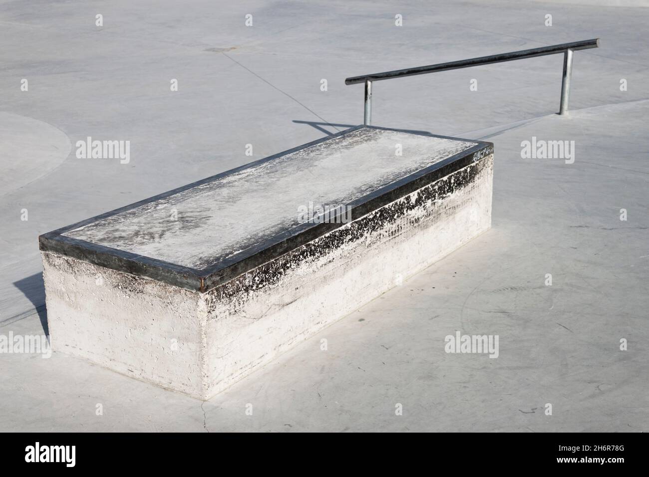 Skatepark concrete ledge. A fixed box with coping for doing grind and
