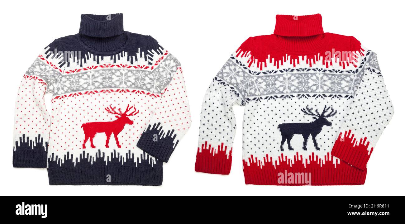 Children's knitted warm seasonal Christmas turtleneck jumpers (Ugly sweaters) with deer and snowflake ornament isolated on white background Stock Photo
