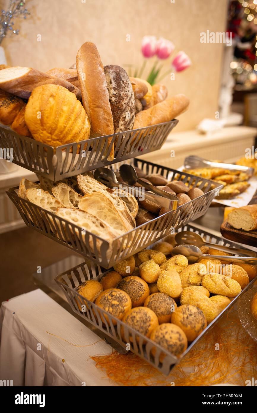 assorted bread basket on the buffet table. Stock Photo