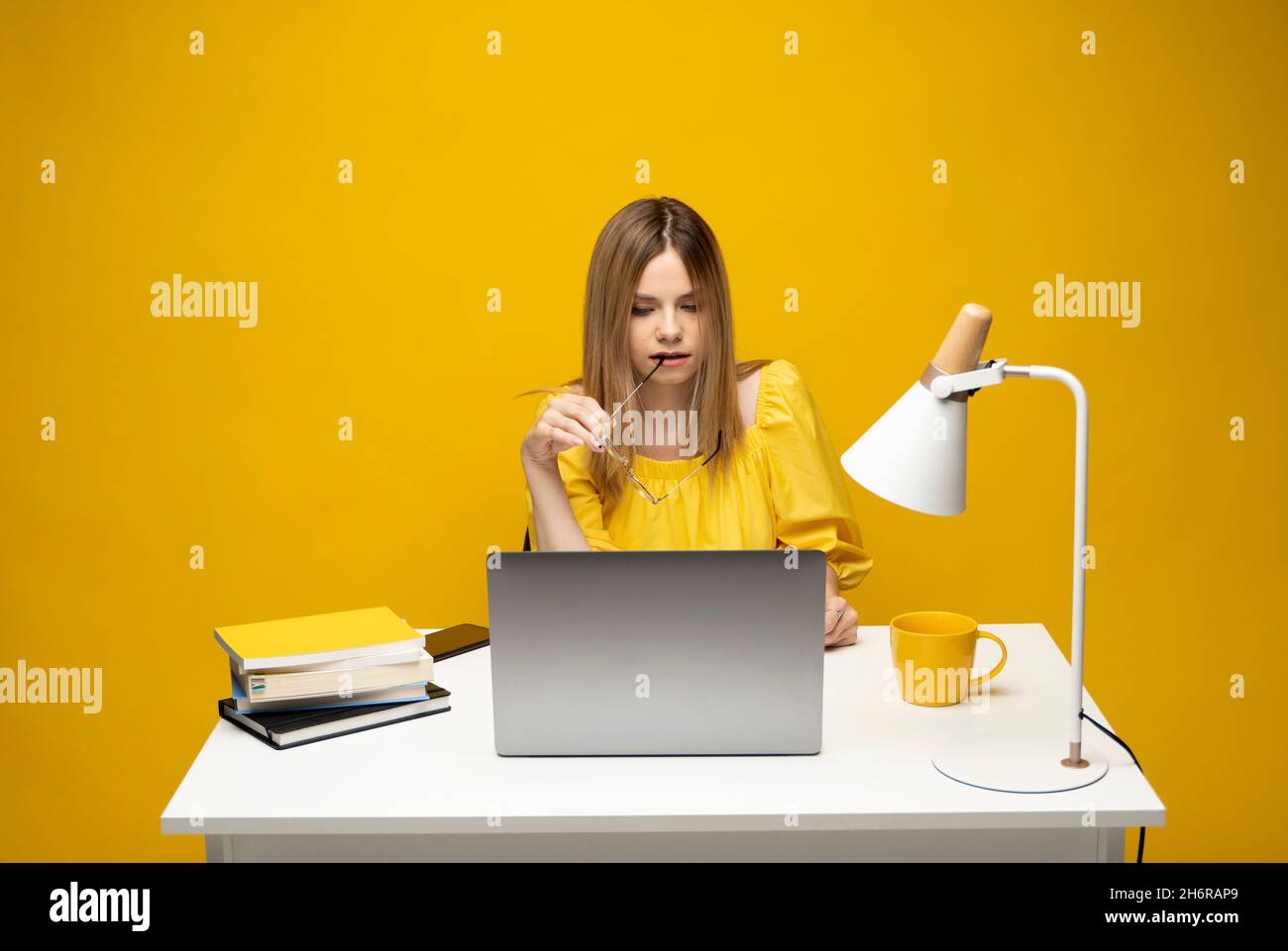 Studio portrait of young successful secretary employee business woman ...