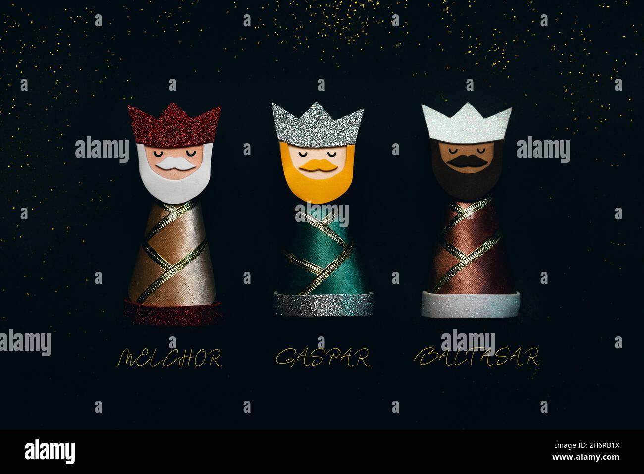 The three wise men with their names and sparkling glitter over black background. Concept for Dia de Reyes Magos day,Three Wise Men Stock Photo