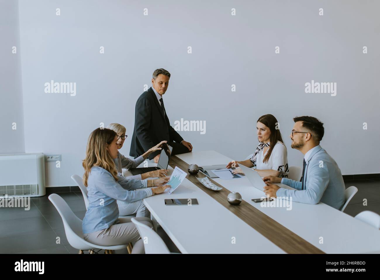 View at group of business people working together and preparing new project on a meeting in the office Stock Photo