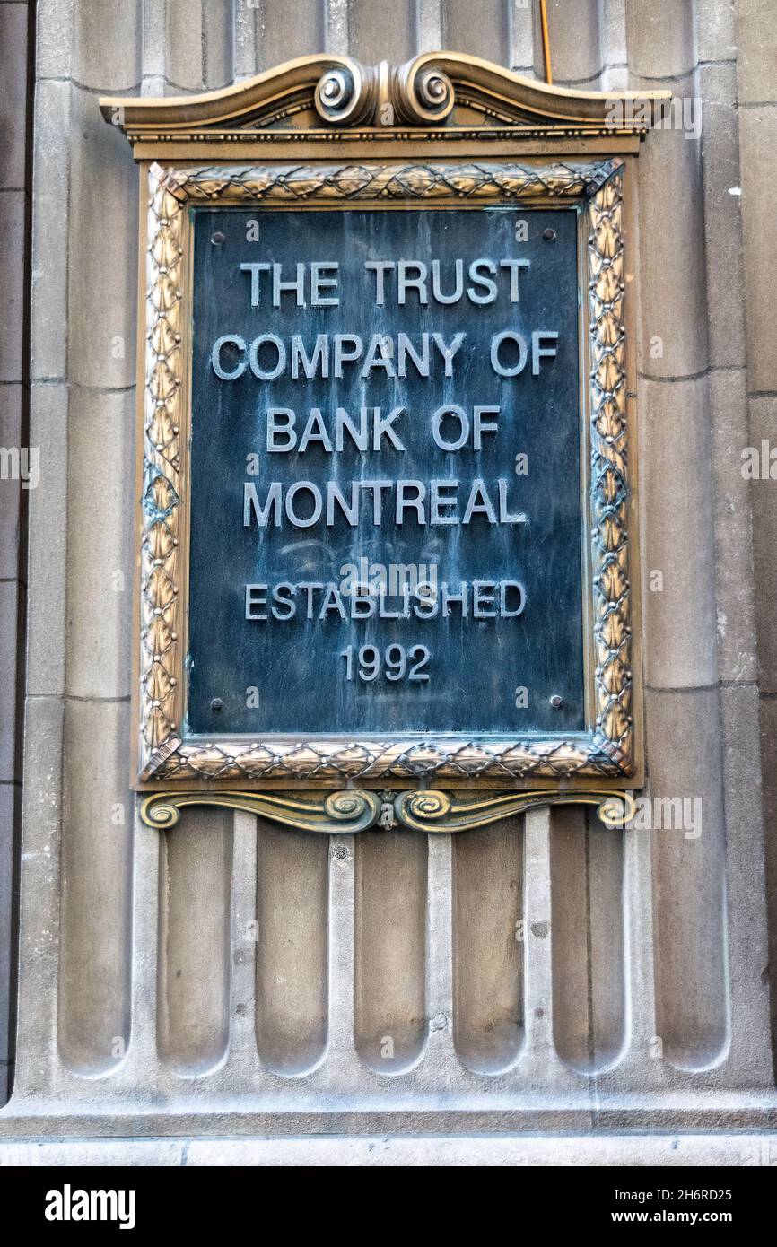 Sign reading 'The Trust of Bank of Montreal' seen on a heritage old building in Toronto, Canada. Nov. 17, 2021 Stock Photo