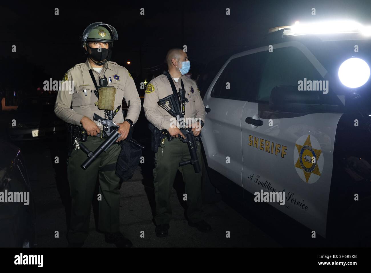 Los Angeles, CA, USA. 31st Aug, 2020. Deputies from the Los Angeles Sheriff's Department stand guard at the scene of the shooting of Dijon Kizzee as a crowd gathers to protest the shooting. Credit: Rise Images/Alamy Stock Photo