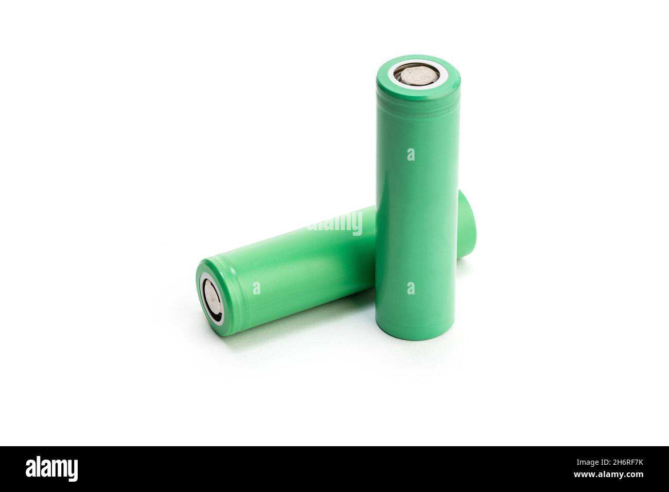 Pair of Green batteries isolated on white background. Blank 18650 Li-ion battery. Copy space Stock Photo