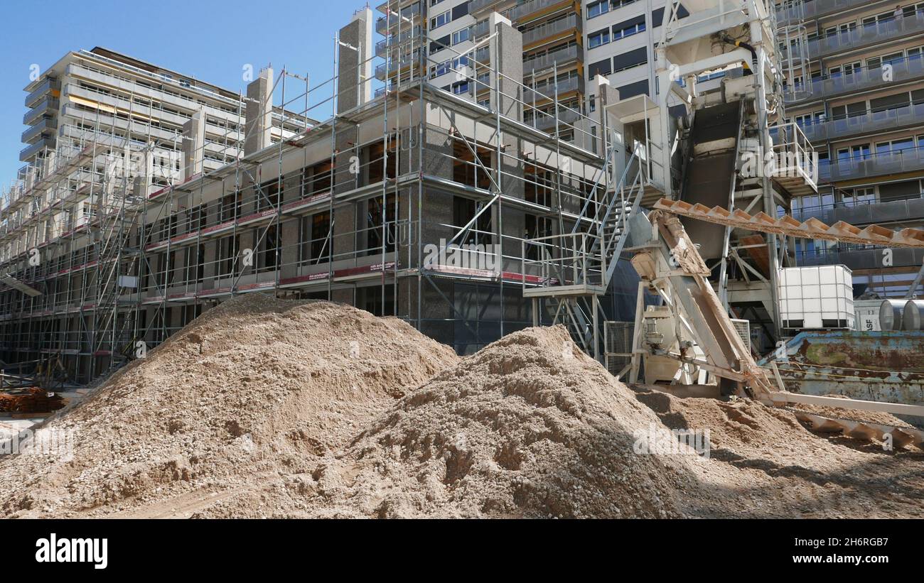 Construction site with scaffoldings and piles of cement Stock Photo
