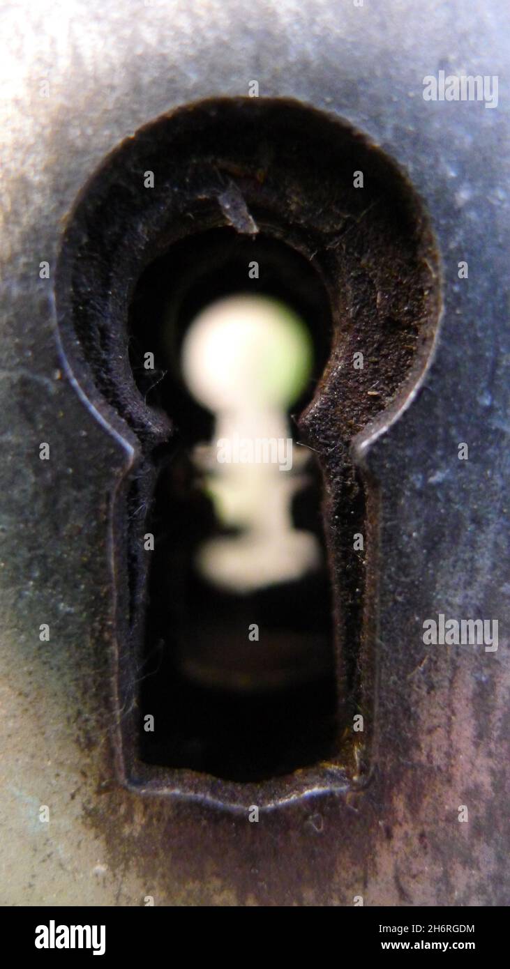 Looking through a keyhole Stock Photo
