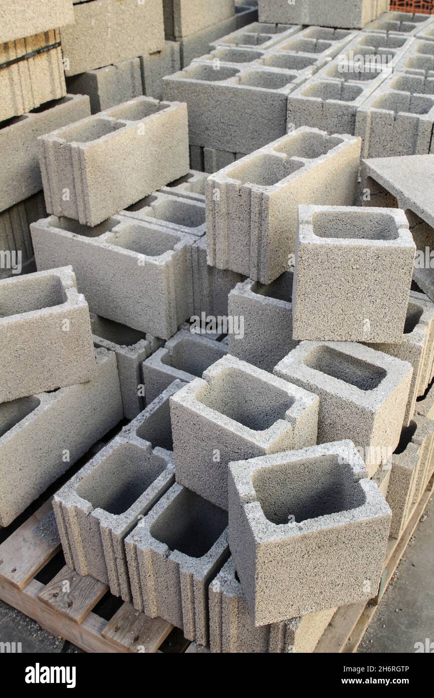Gray concrete bricks for sale in a warehouse Stock Photo Alamy