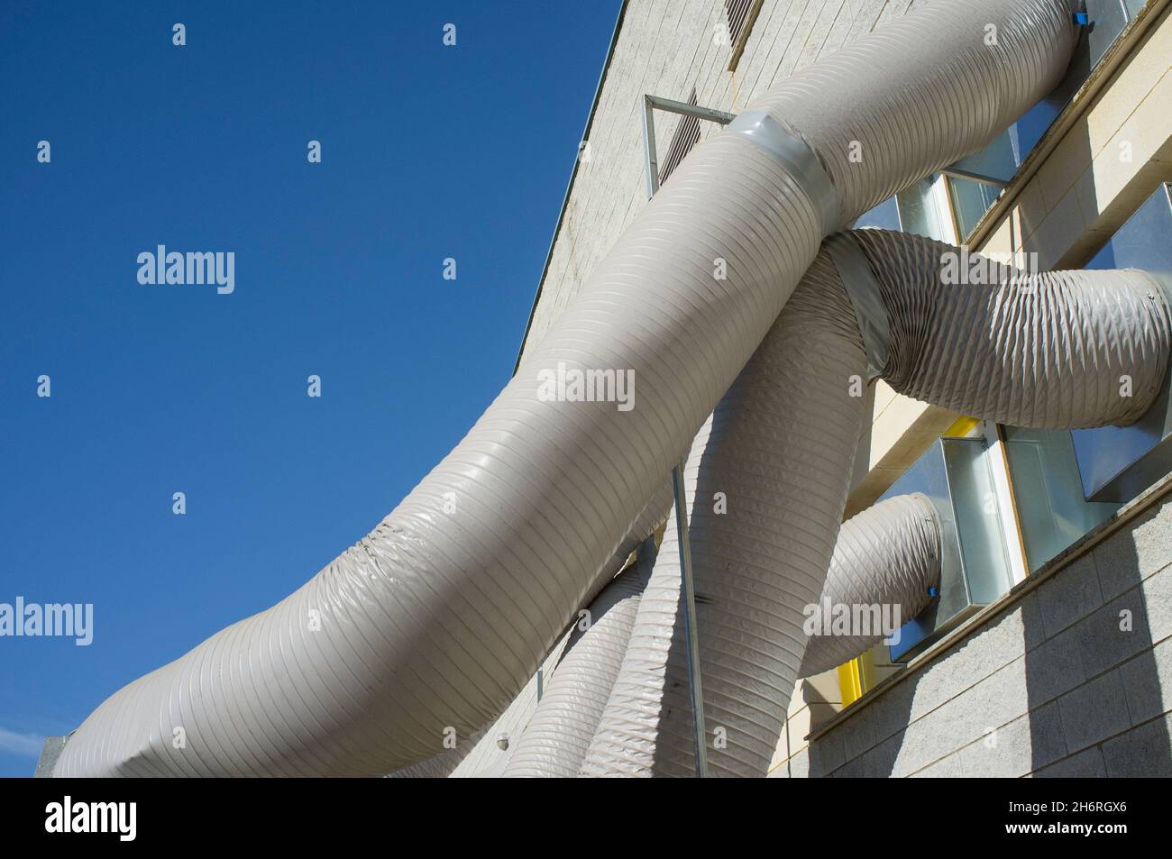 Temporary air conditioning machinery outdoors. Huge tubes are inserted