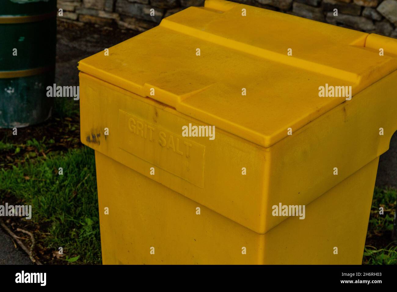 A yellow plastic grit bin at the side of a road in Yorkshire, England