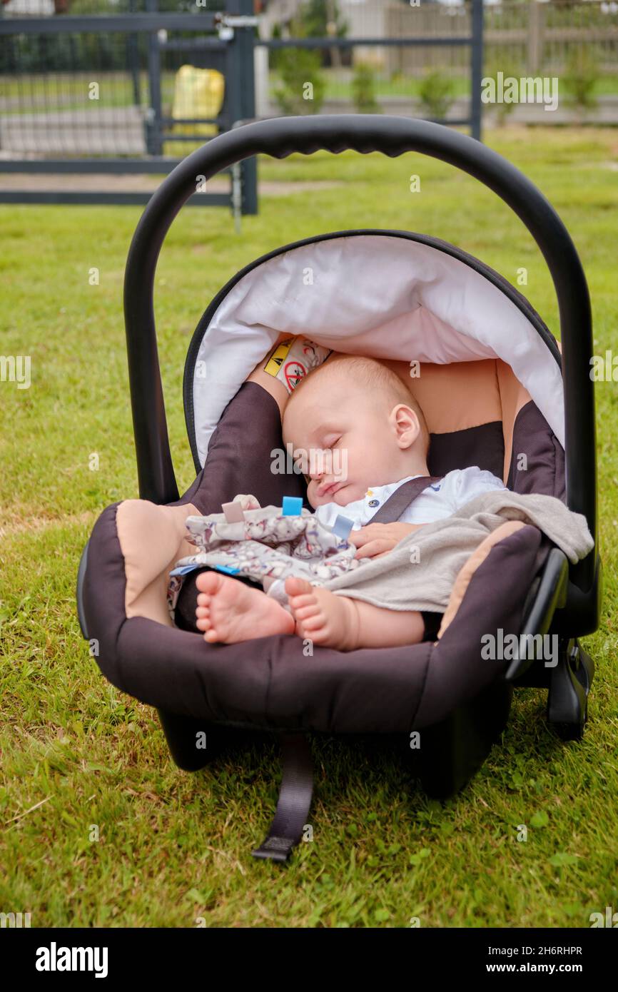 full-length view of an adorable baby sleeping in a pram outdoors Stock Photo