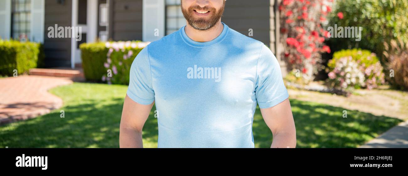 cropped man standing on background of house, ownership Stock Photo