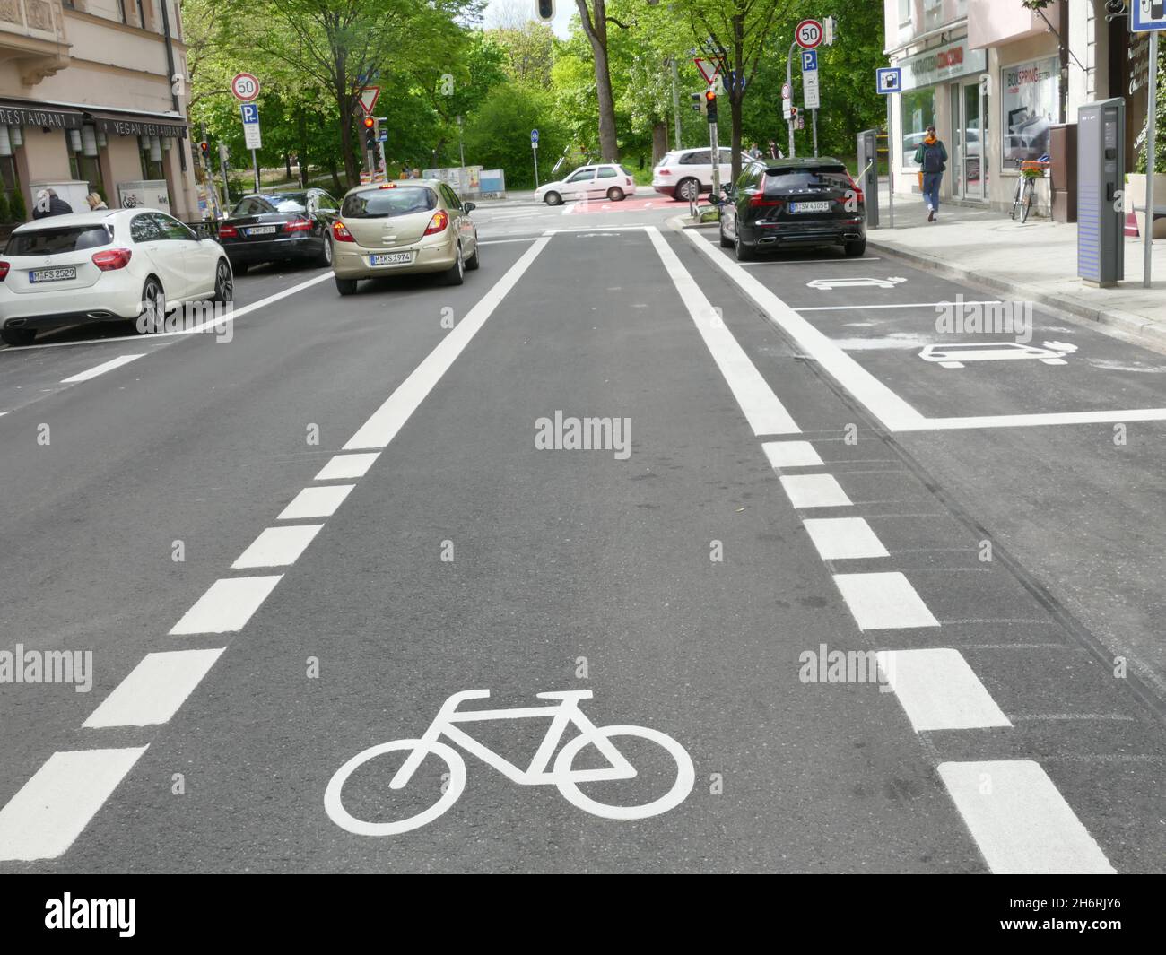 Pop up bike way, Munich. Straight bike way on grey asphalt. Stock Photo