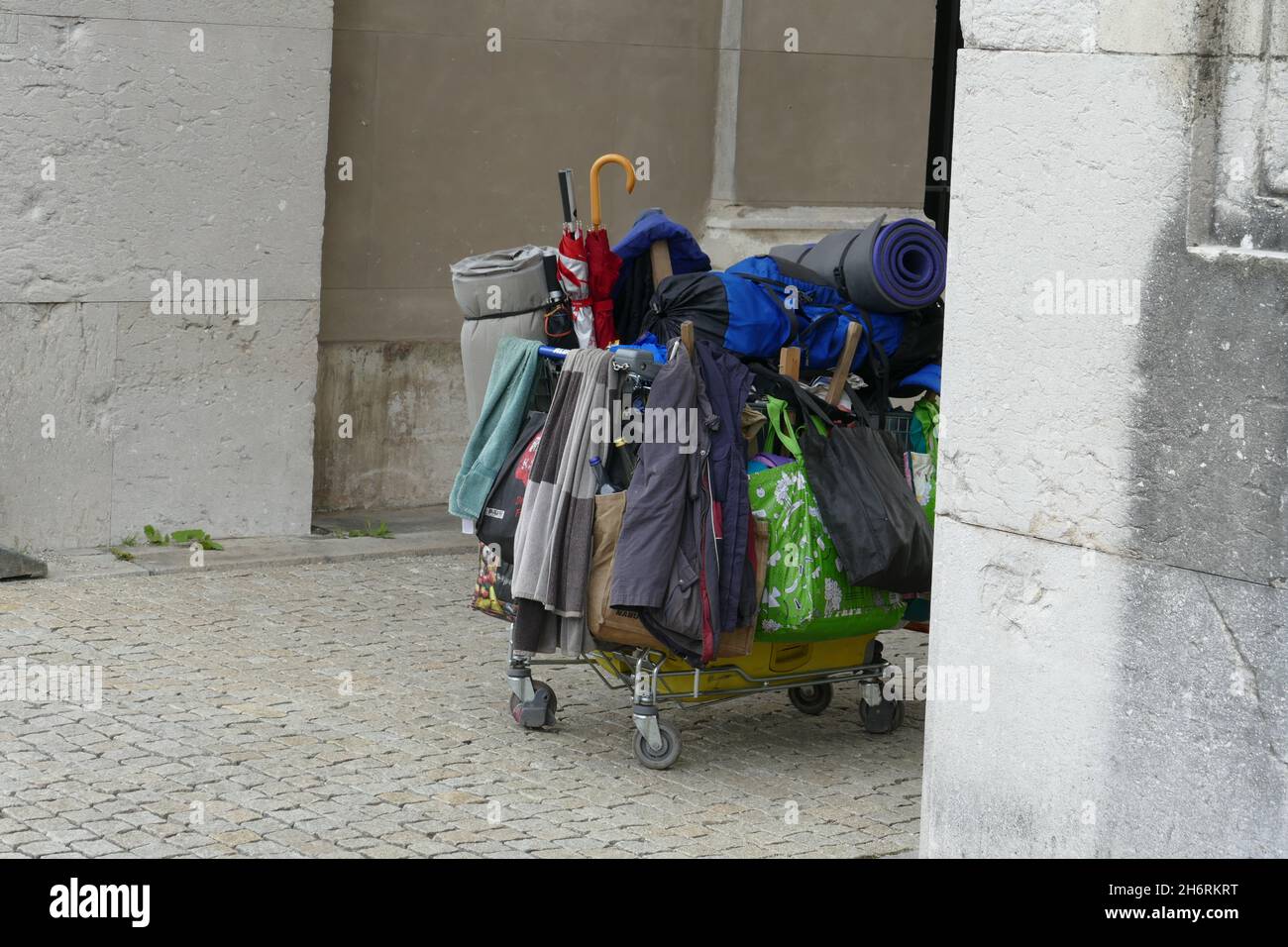 Poverty, homelessness. Rollcart of a homeless person with his belongings. Stock Photo