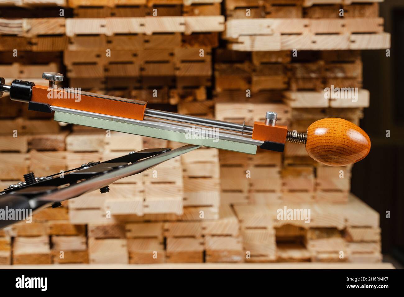 Sharpening knife process using professional sharpener with whetstone in