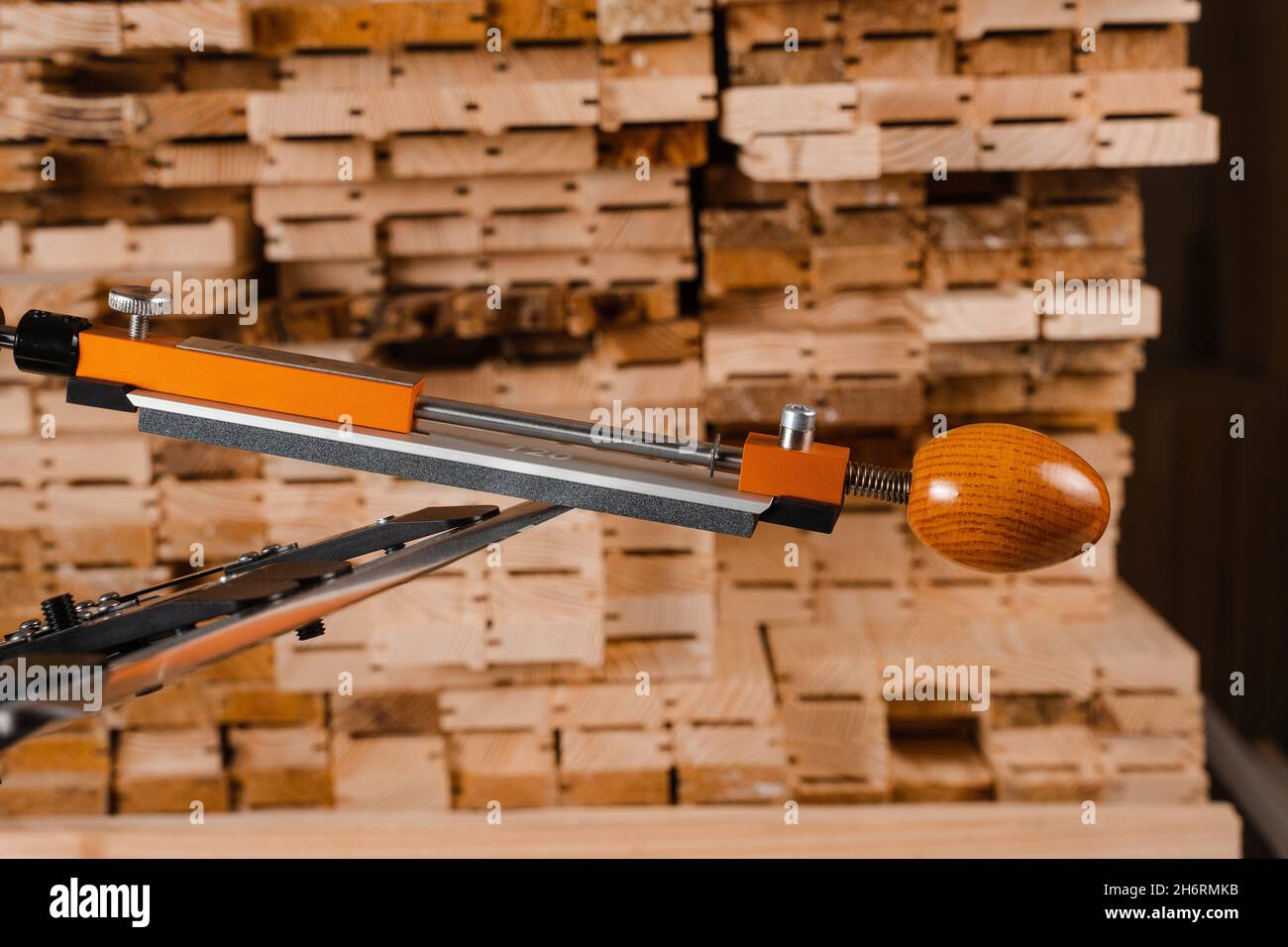 Sharpening knife process using professional sharpener with whetstone in