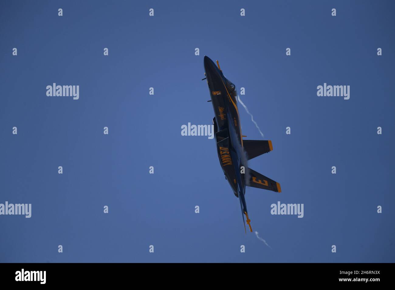 Blue Angel 3 pulls vapor while pulling away after a split of the diamond formation Stock Photo