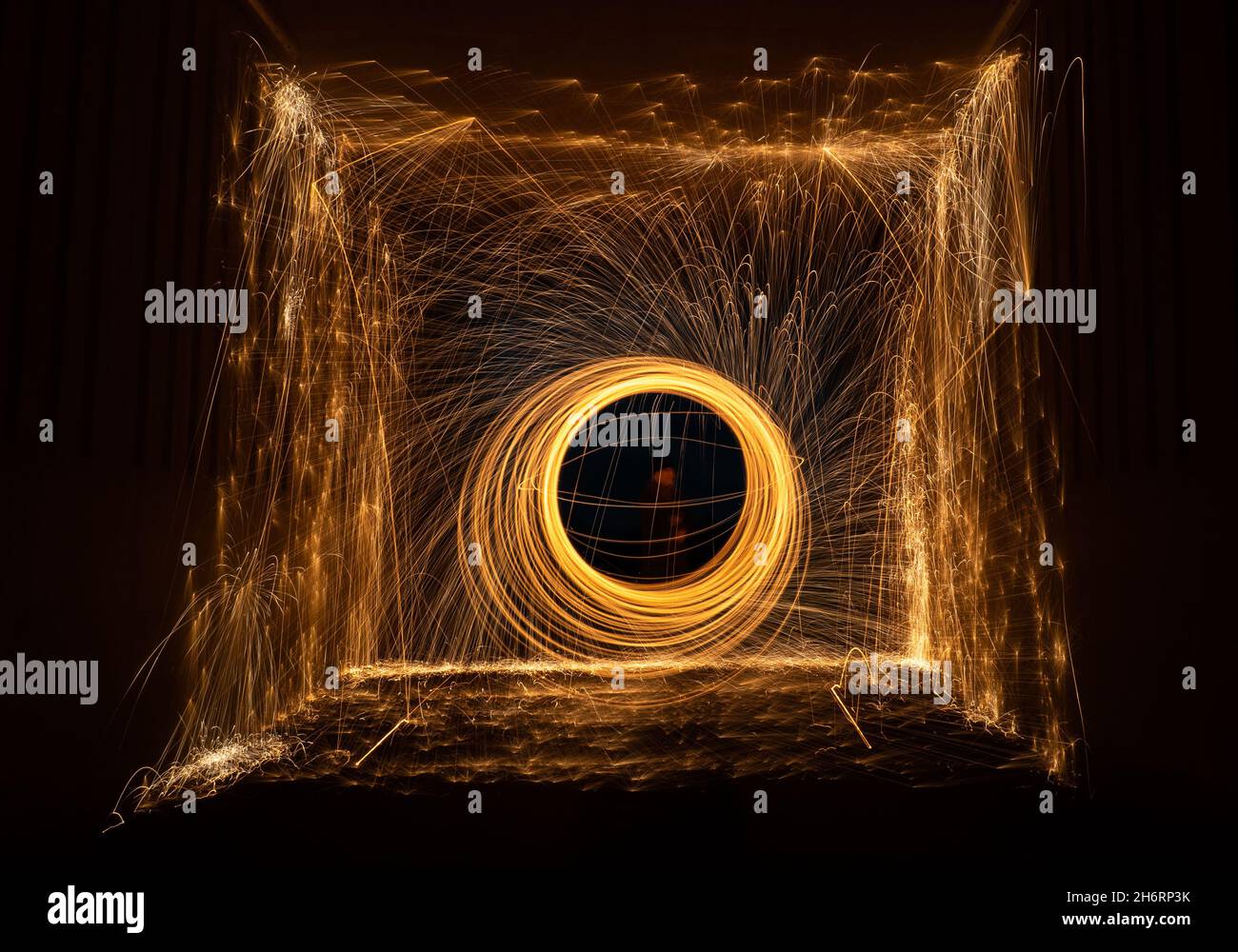 Scotland, United Kingdom, 17th November 2021. Light painting at night: the dark nights offer an opportunity to experiment with light painting by setting light to steel wool in a tunnel Stock Photo