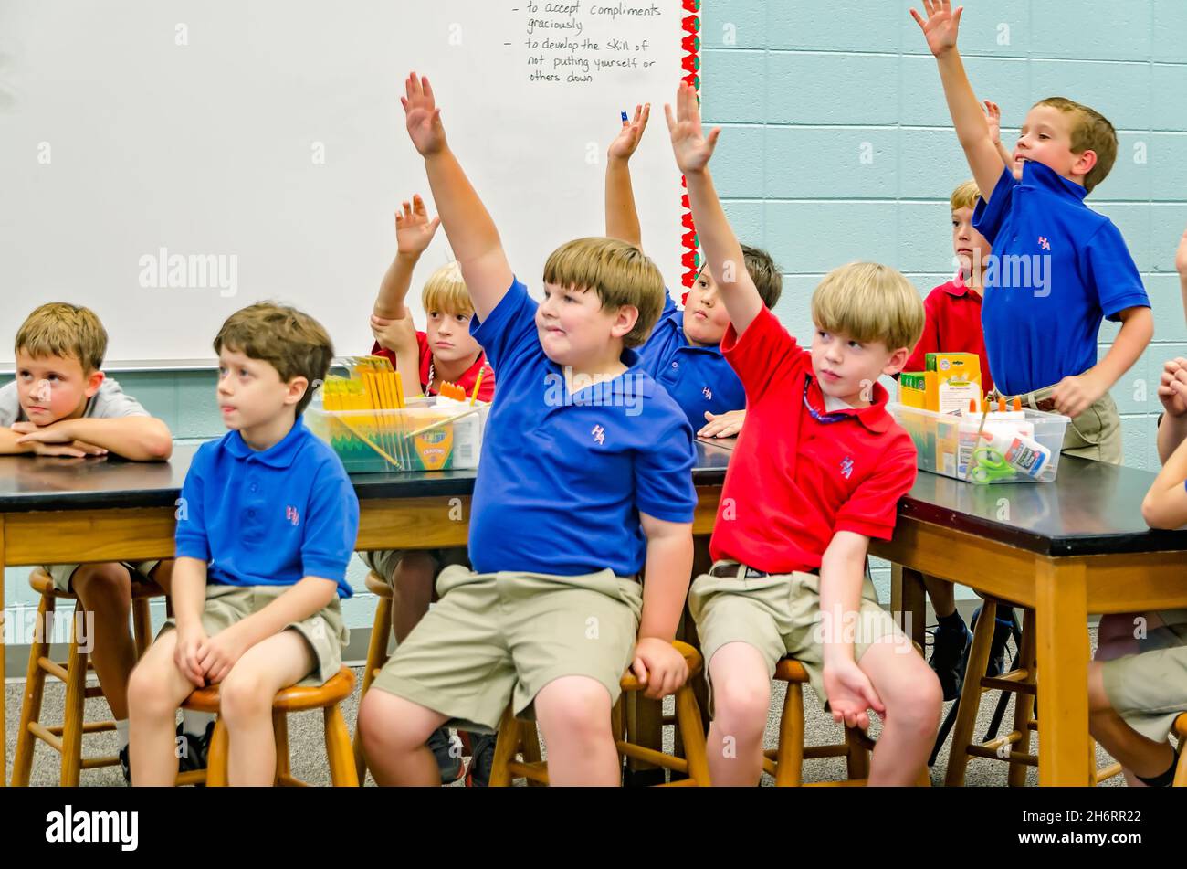 School students raise hands hires stock photography and images Alamy