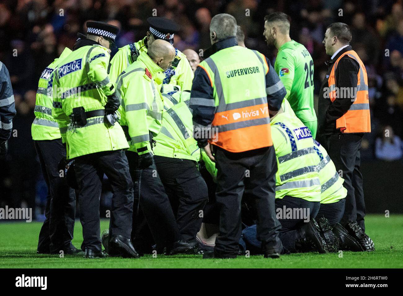Stockport, England on 17 November 2021. Police detained a Stockport County fan during the FA Cup replay match between Stockport County and Bolton Wanderers at Edgeley Park, Stockport, England on 17 November 2021. Photo by Mike Morese. Editorial use only, license required for commercial use. No use in betting, games or a single club/league/player publication Credit: UK Sports Pics Ltd/Alamy Live News Stock Photo
