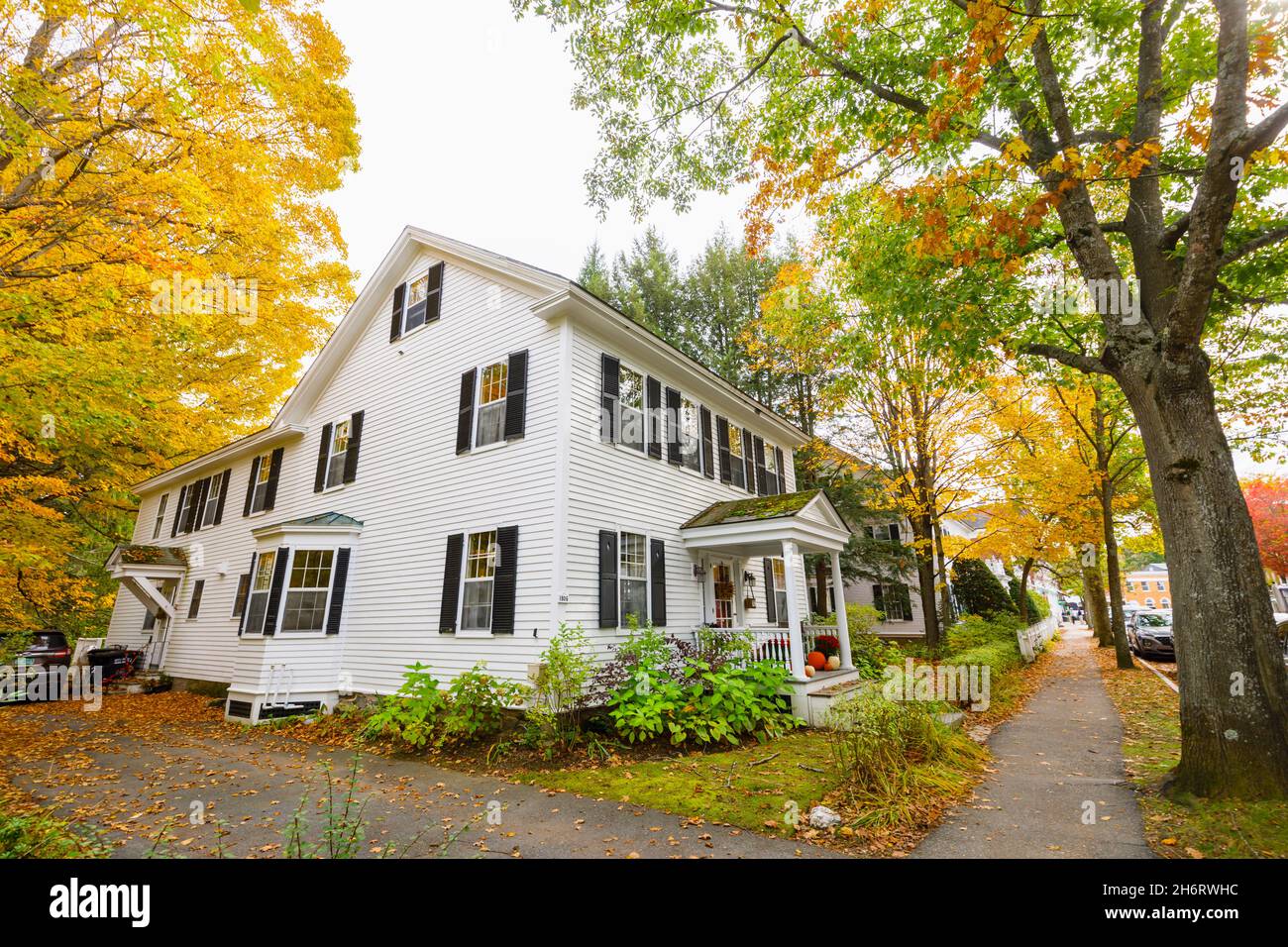 Typical local style large white clapboard faced house in Woodstock, Vermont, New England, USA Stock Photo