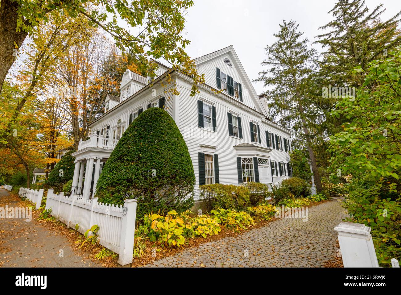 Typical local style large white clapboard faced house in Woodstock, Vermont, New England, USA Stock Photo