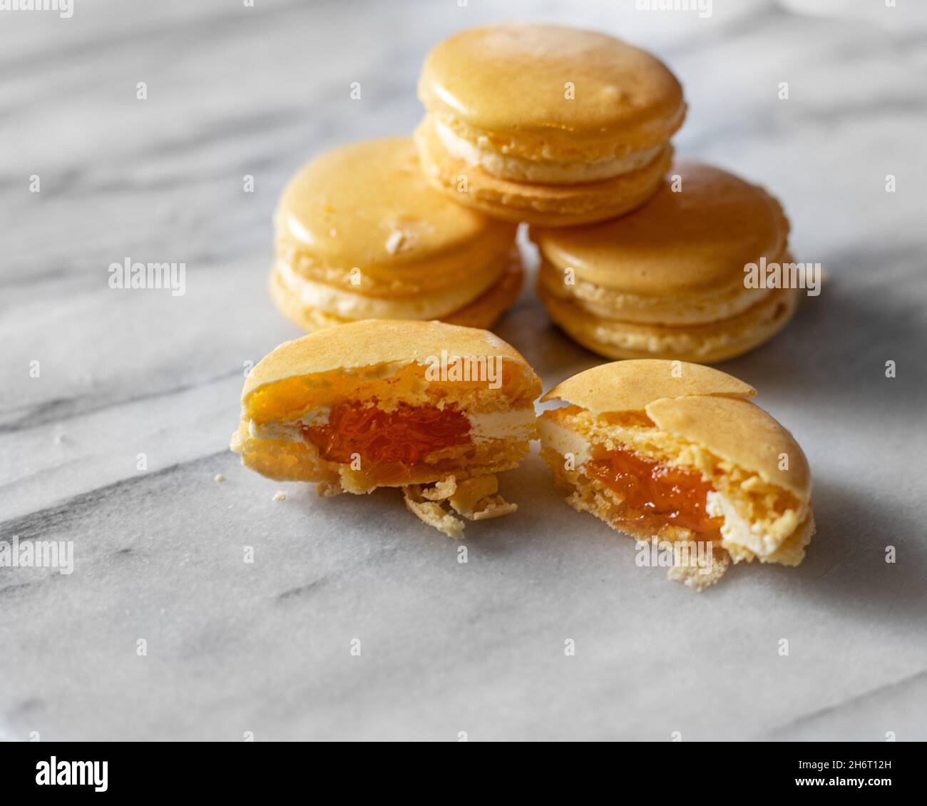 Mango Macarons on White Marble Stock Photo