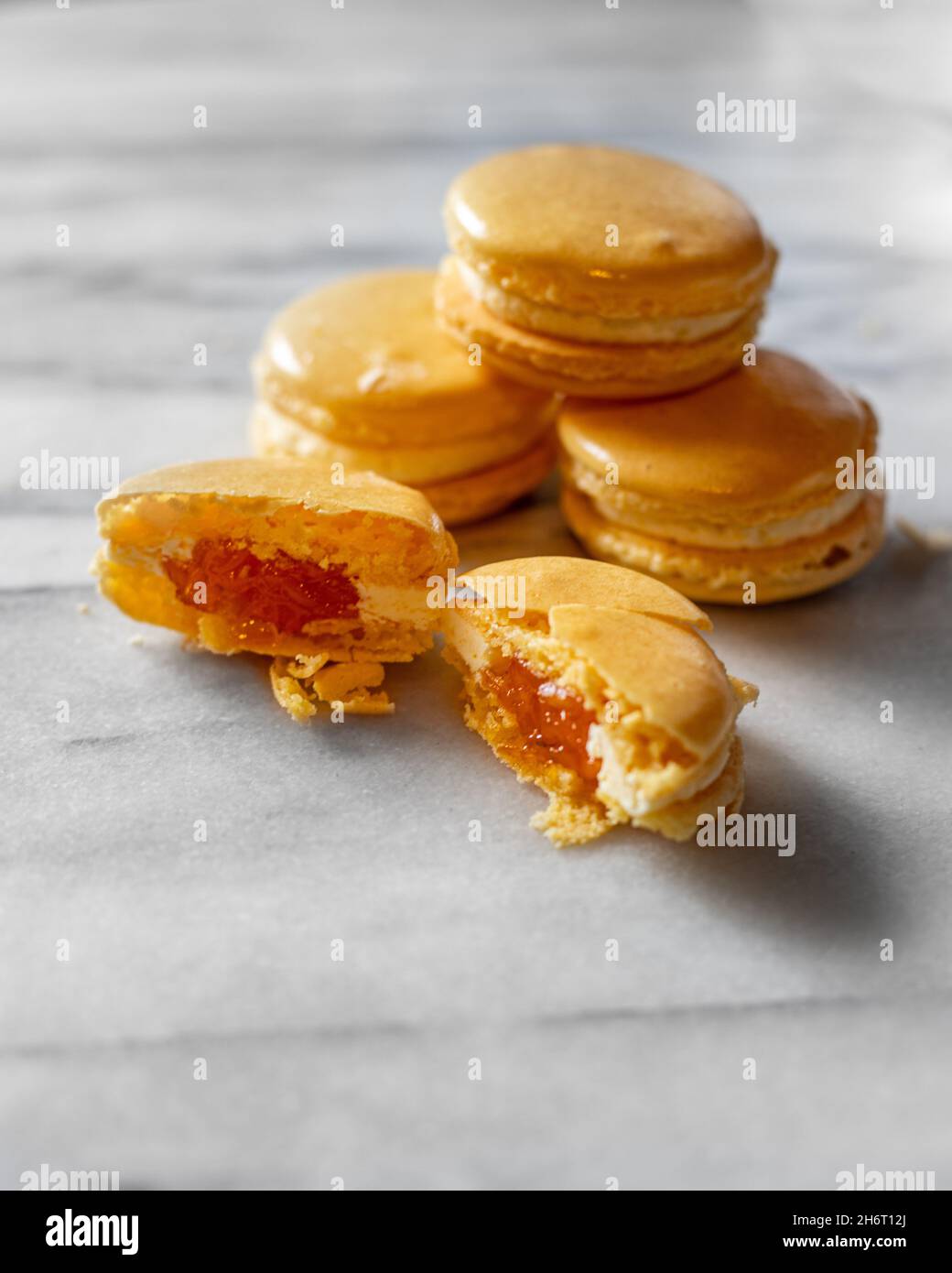 Mango Macarons on White Marble Stock Photo