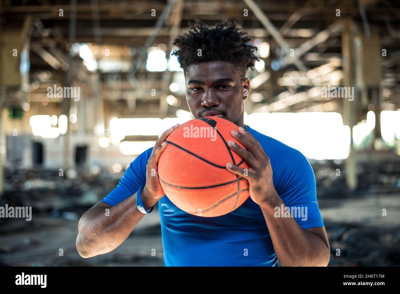 1970s AFRICAN AMERICAN MAN BASKETBALL PLAYER HOLDING BALL Stock Photo -  Alamy