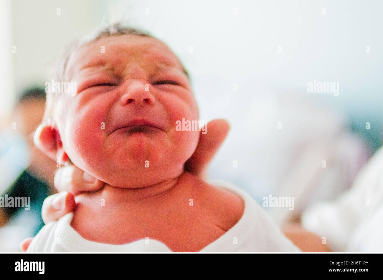 Newborn Baby face and hand Stock Photo