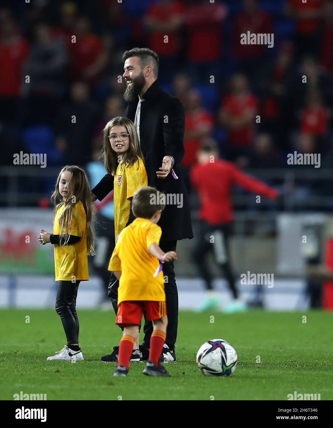 Cardiff, UK. 16th Nov, 2021. Joe Ledley, the Welsh football player on the field with his children at halftime after he announced that he was retiring from football. FIFA World Cup qualifier, group E, Wales v Belgium at the Cardiff city stadium in Cardiff, South Wales on Tuesday 16th November 2021. Editorial use only. pic by Andrew Orchard/Andrew Orchard sports photography/Alamy Live News Credit: Andrew Orchard sports photography/Alamy Live News Stock Photo