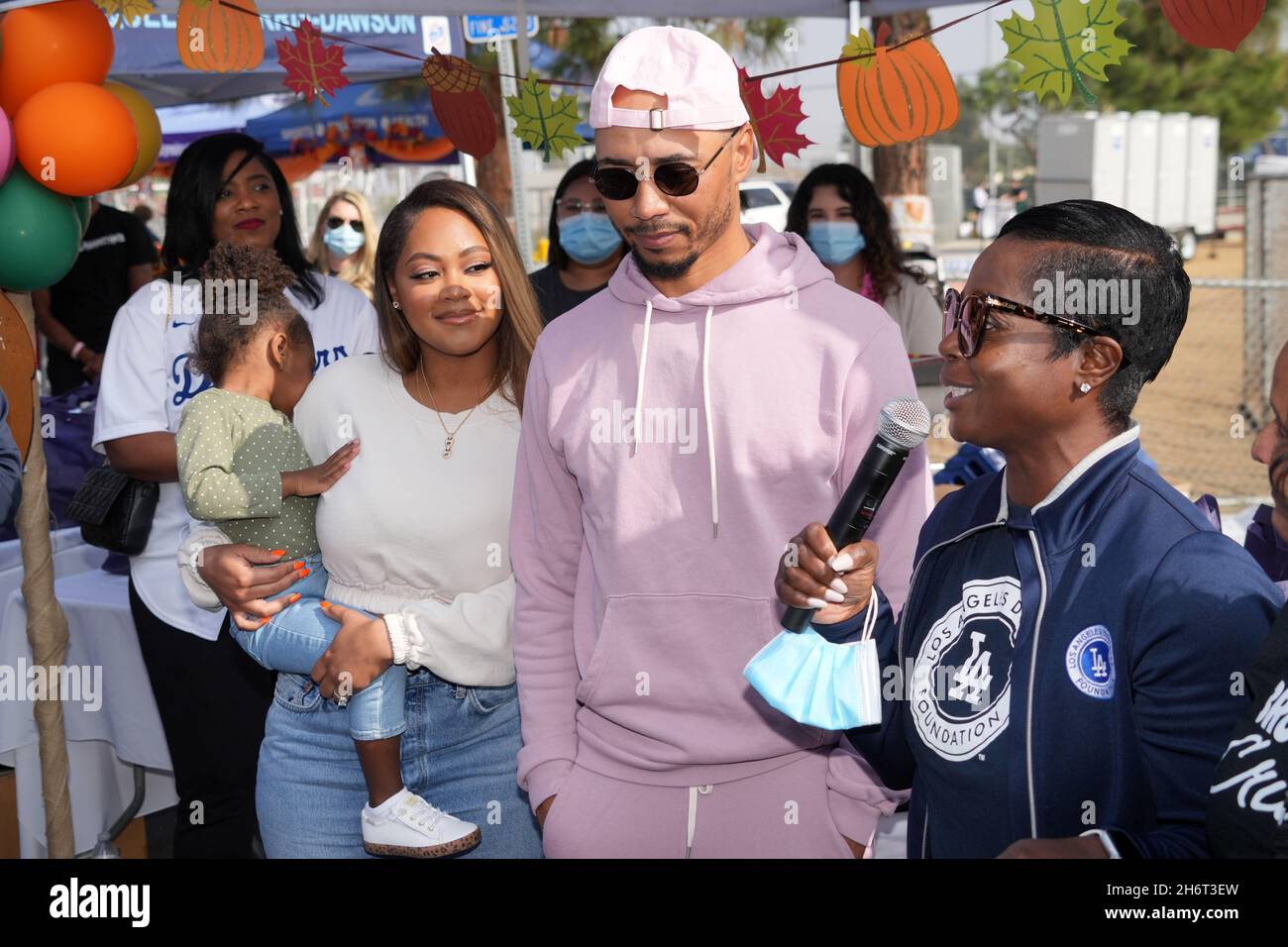 Mookie Betts (center) with fiance Brianna Hammonds and Los Angeles Dodgers  Foundation chief executive officer Nichol Whiteman during the Los Angeles D  Stock Photo - Alamy