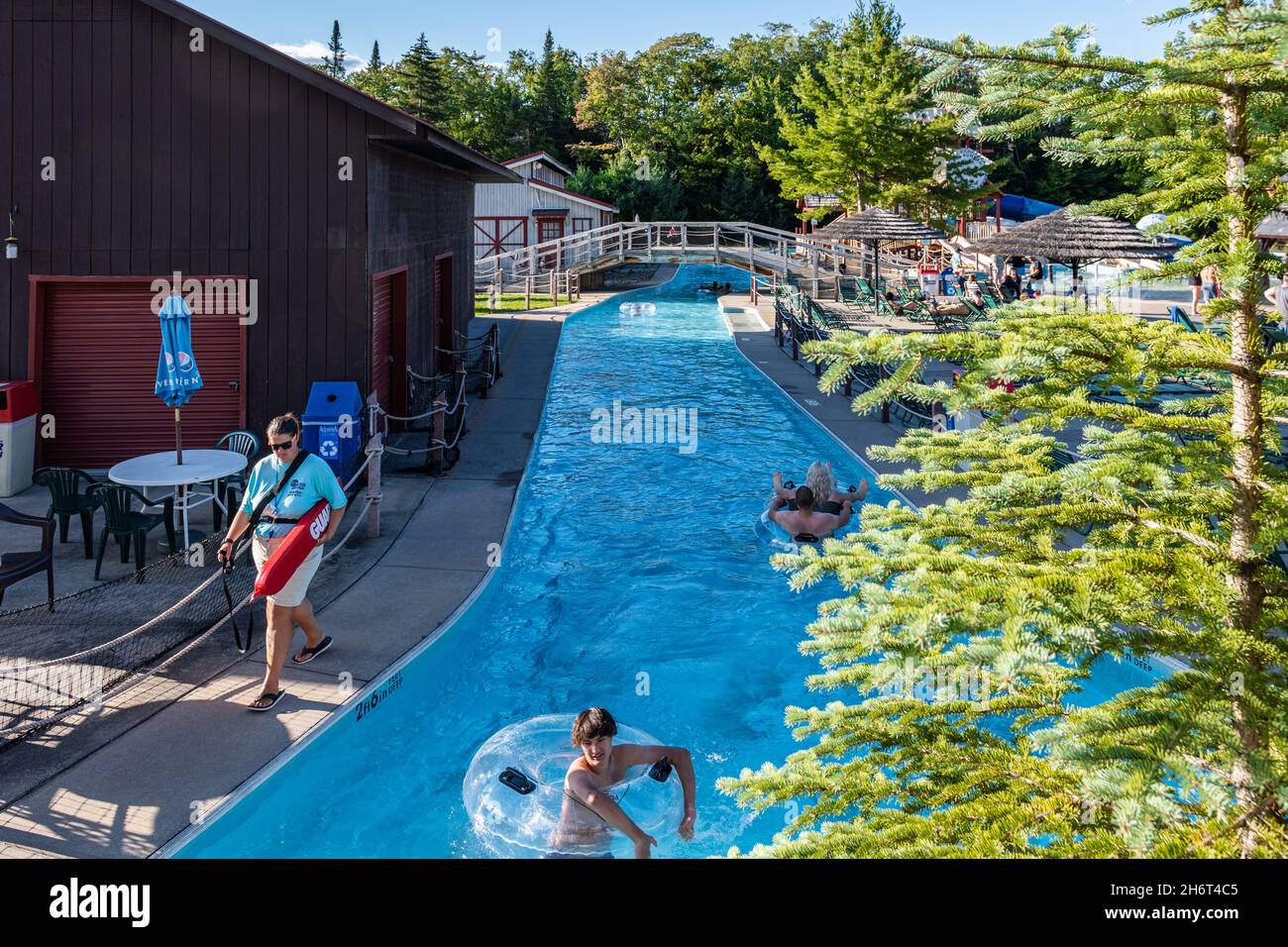 Old Forge, New York - September 4, 2021: Horizontal View of the Basin Stream of the Water Safari Park with People Swimming. Stock Photo