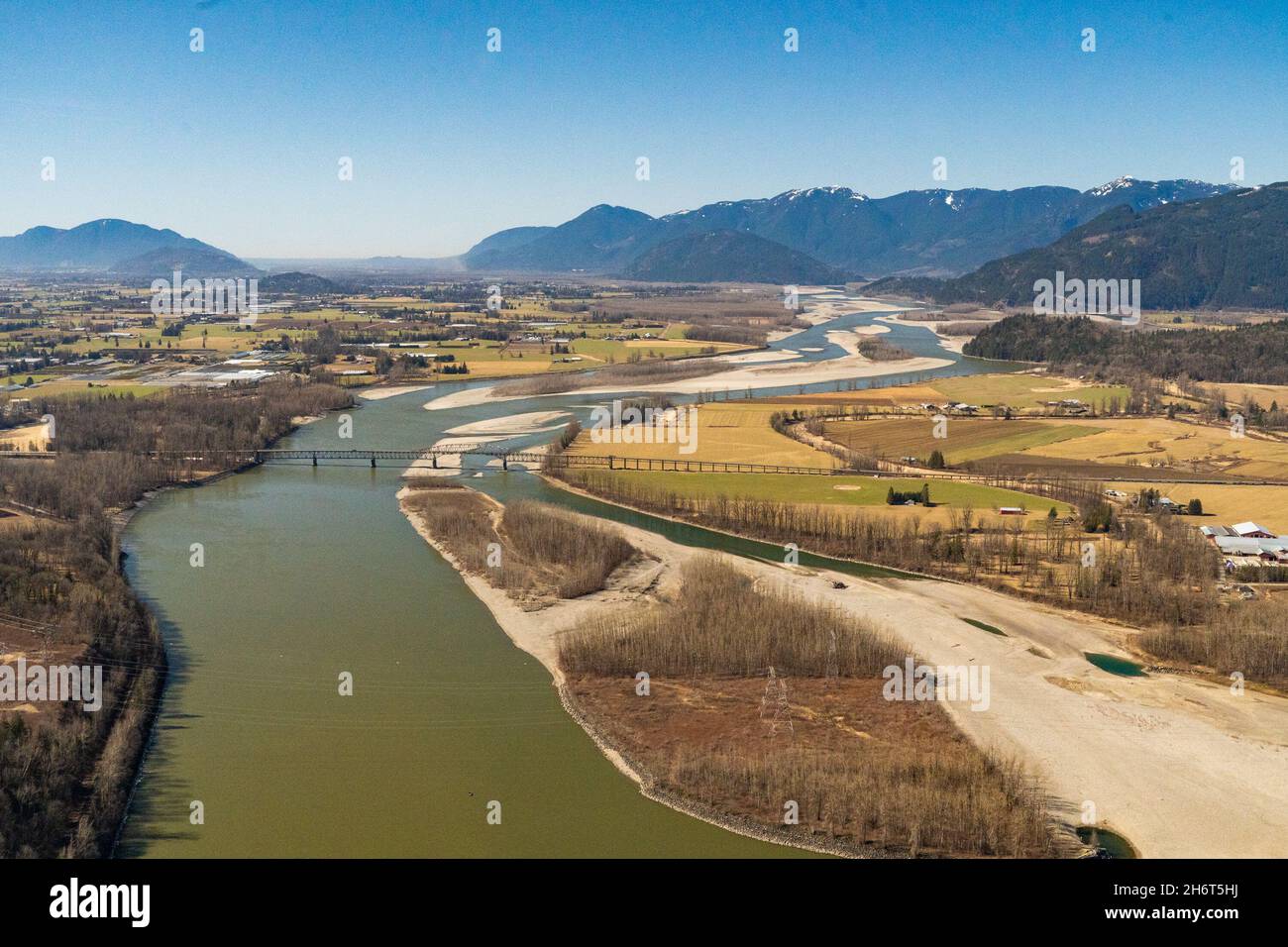 Fraser River by the village of Rosendale with the Rosendale - Agassiz highway bridge in the background. Stock Photo