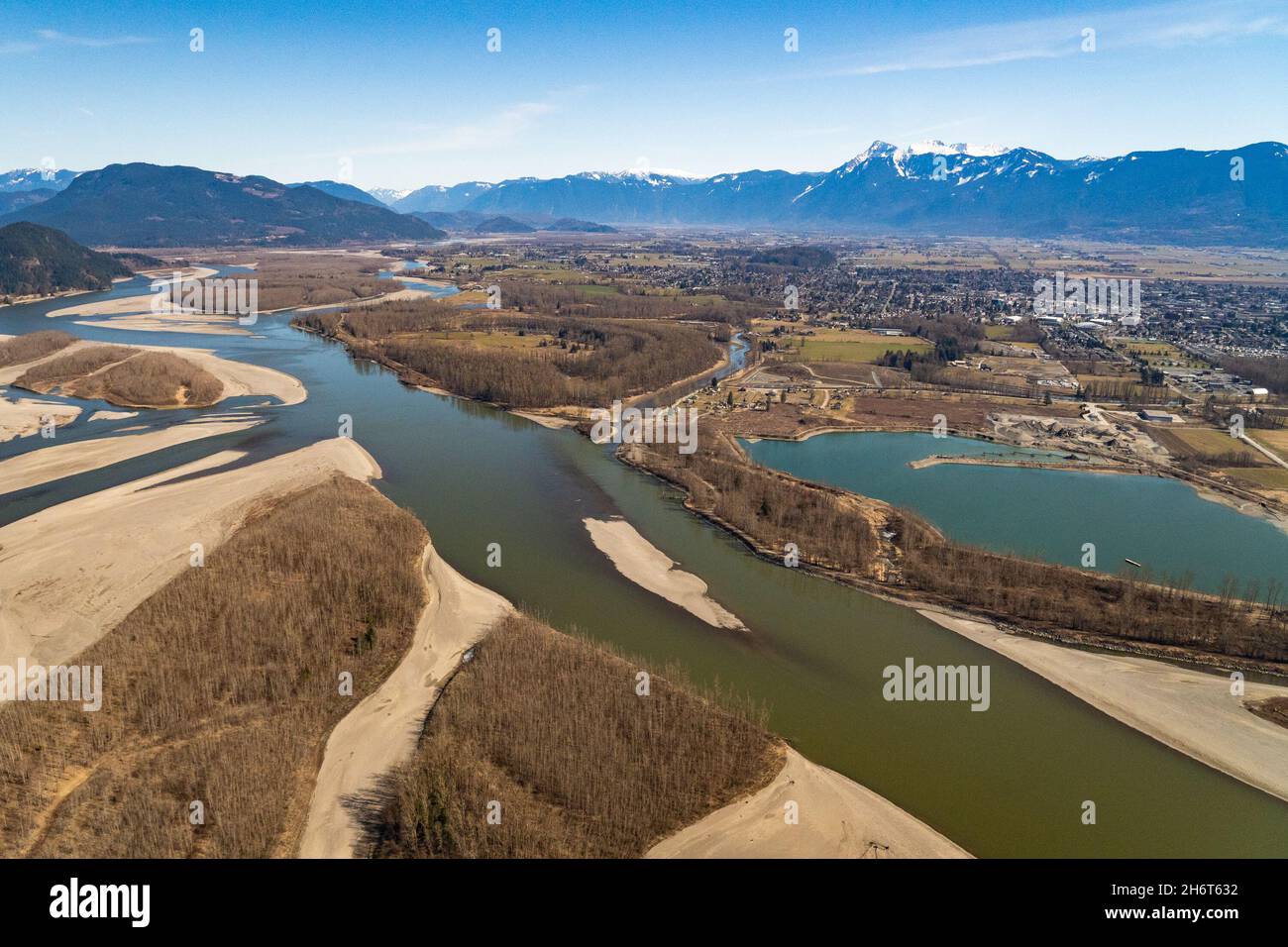 View of the Lower Fraser River Valley during drought period with the city of Chilliwack in the background. Stock Photo