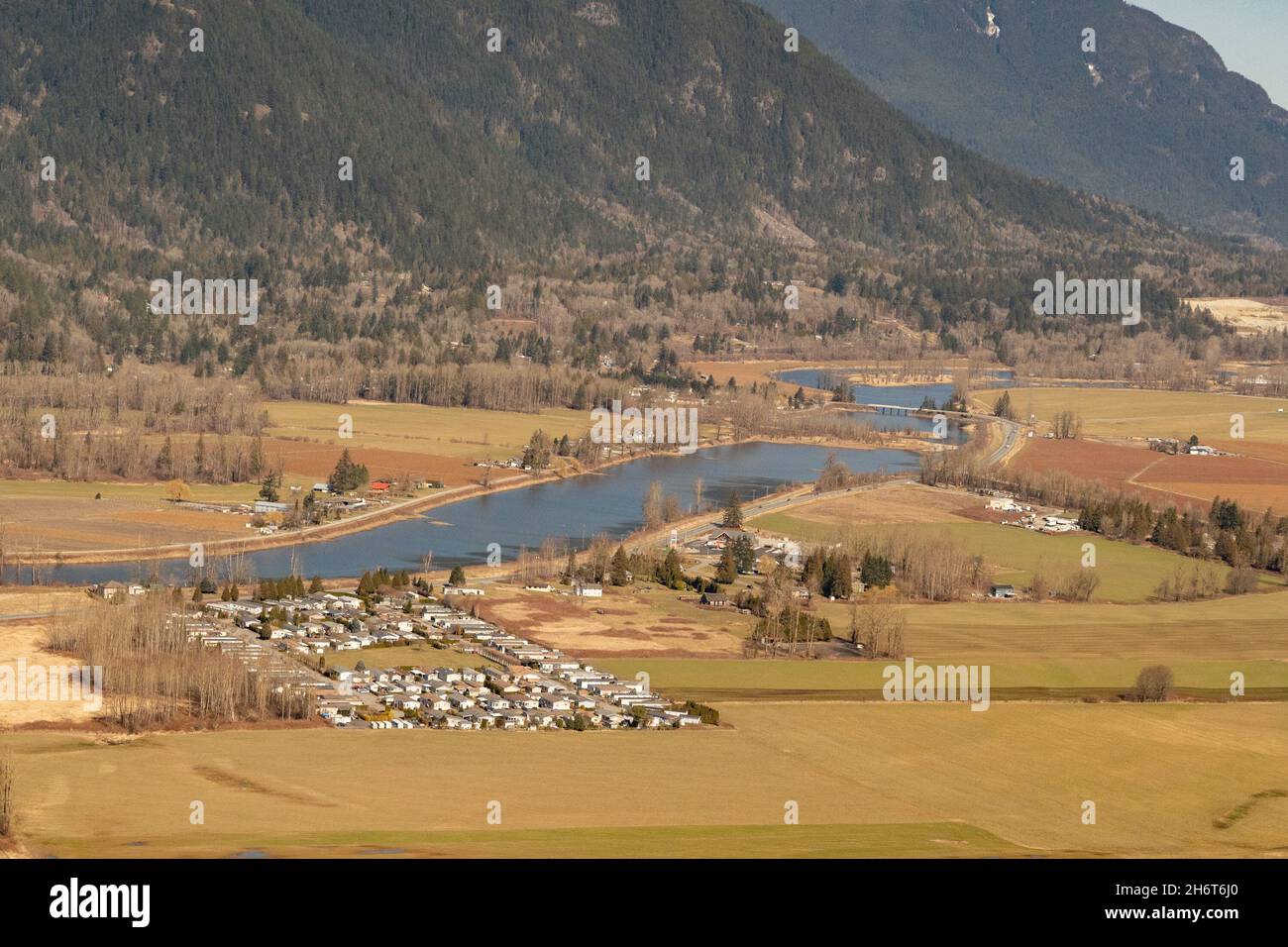 Sumas Prairie, by the city of Chilliwack,  Farmland, and the Nicomen slough during low water levels in Spring. Stock Photo
