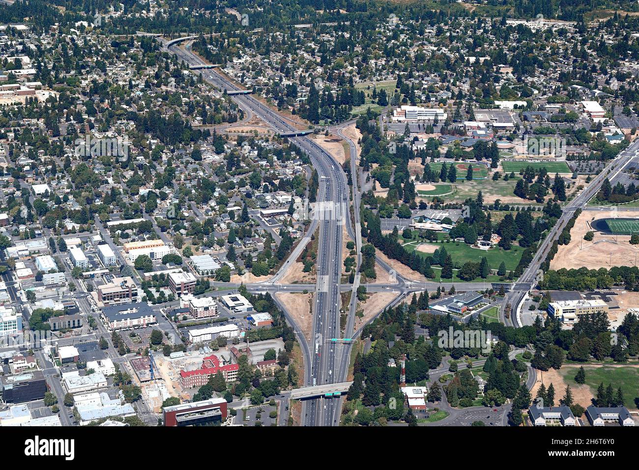 Aerial view of a highway running through a suburban area Stock Photo
