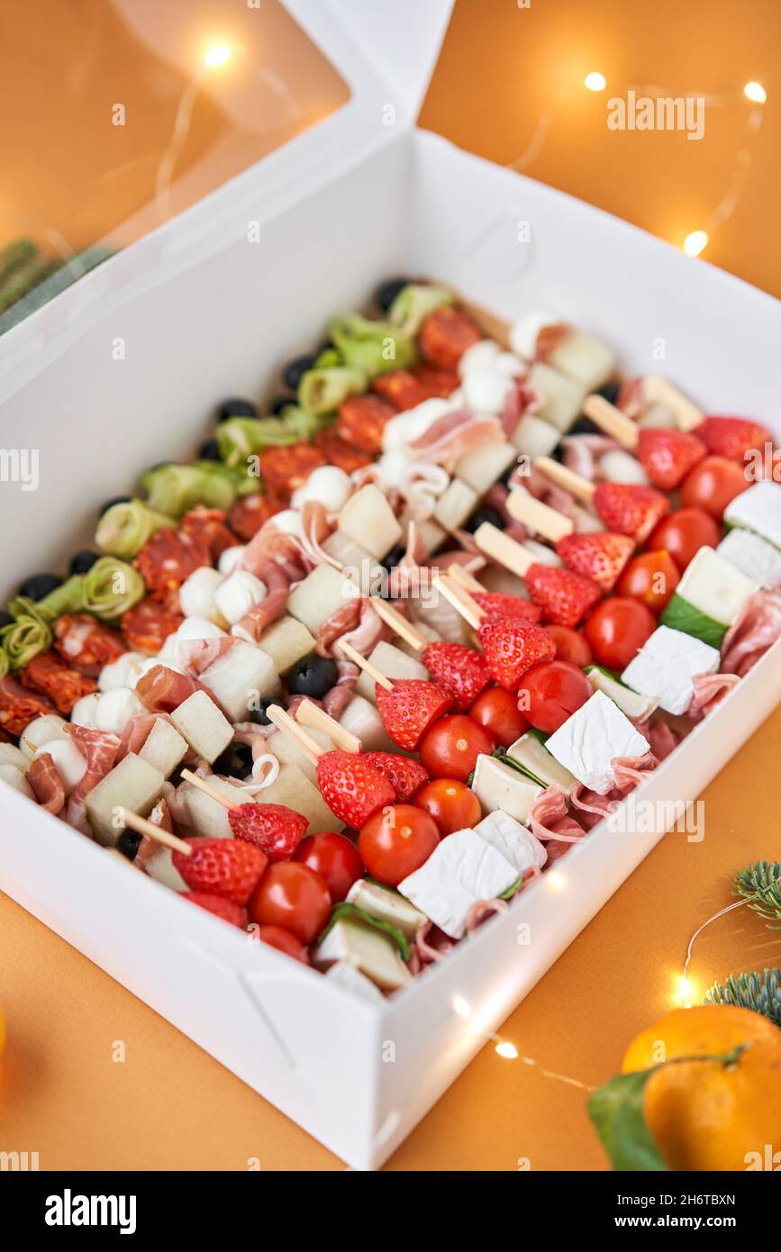Assorted canape with cheese, meat, and vegetables. Snacks in take way box.  Menu food for delivery in the Coronavirus Pandemic. selective focus Stock  Photo - Alamy