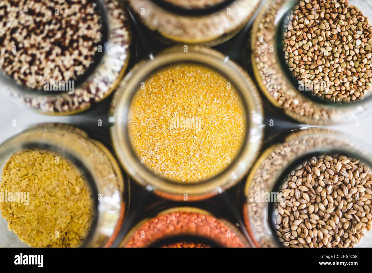 polenta cornmeal and other healthy whole grains and legumes in clear
