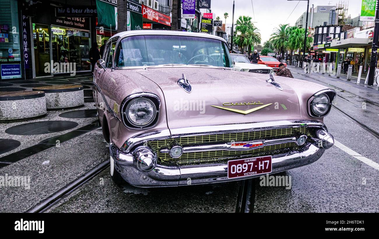 Chevrolet Bel Air classic car parked in the street after rain. Wet drops over it. Family event at St Kilda car show during the first day of spring. Stock Photo
