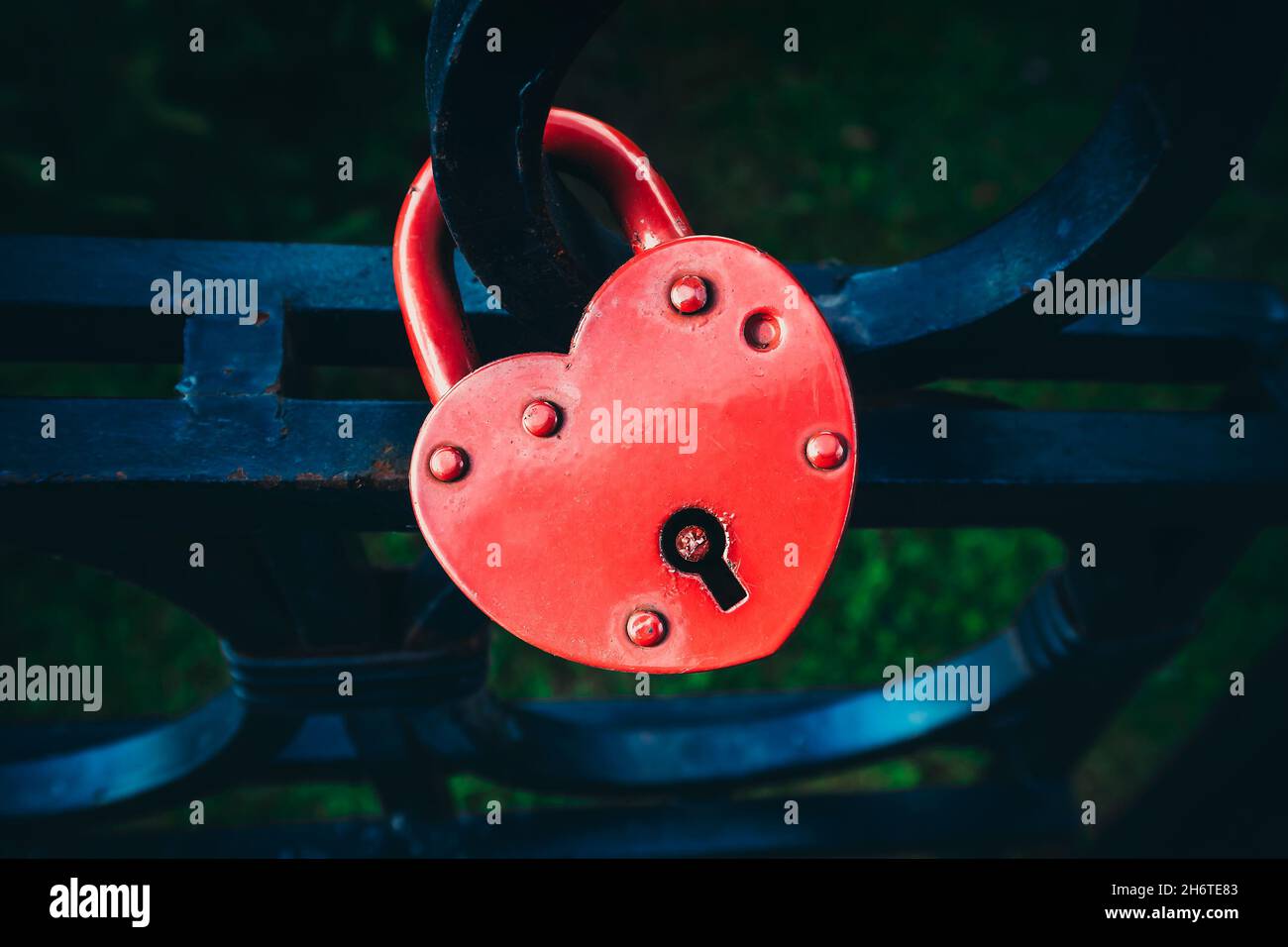 Red Heart Shaped Padlock on the Fence closeup Stock Photo - Alamy