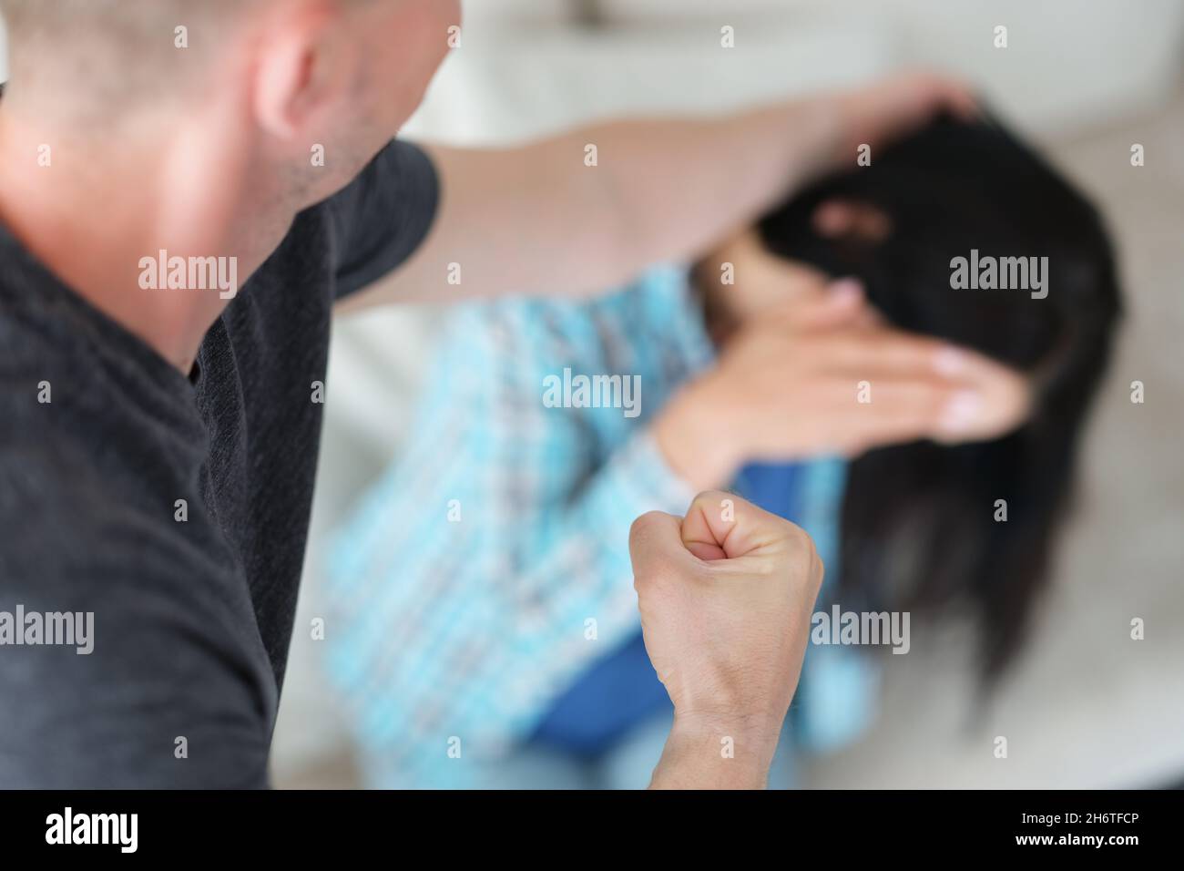 Angry husband pull wife hair and clench his fist in aggression Stock Photo  - Alamy