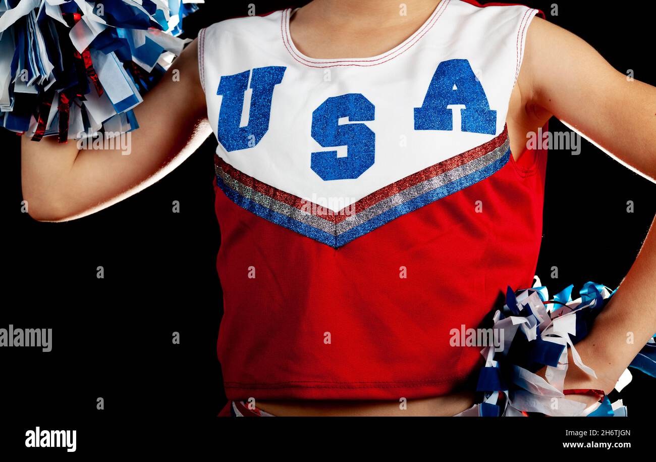 Portrait of cheerleader ( 8-9 years) holding pom-pom Stock Photo - Alamy