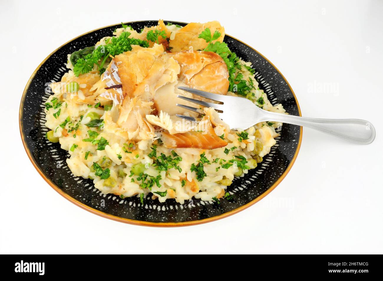 Smoked haddock fish creamy rice risotto meal Stock Photo Alamy